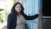 Film subject Iselsa stands outside her home in Valparaiso, Chile