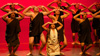 Hoʻonani leads the boys in a performance of ʻai ka mūmū kēkē, a chant and hula about overcoming adversity