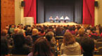 [Picture of crowd at community cinema event.]