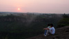 Qin and her brother talk on the mountain where they usually play before she sets on her unknown jouney to the city. 