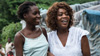Alfre Woodard with a young girl on location in Haiti
