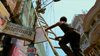 Loha Singh fixes a ladder to reach the power lines.