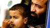 Abu Amar al Azzam waiting with his son Abu Bakr al Azzam in their van.