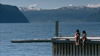Alexandra and Mia sitting on the dock by the sea